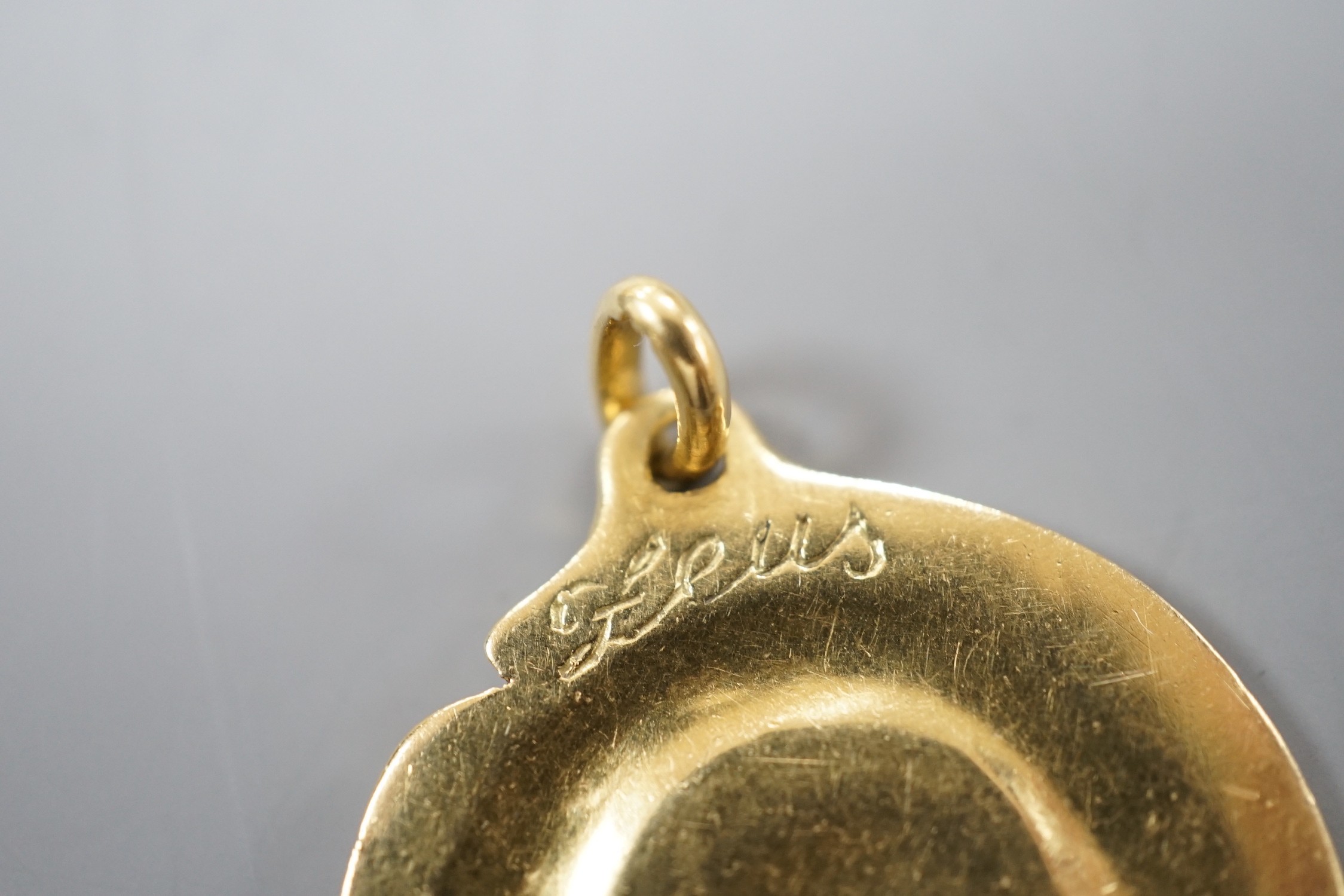 A modern Italian 18k yellow metal Tiffany & Co circular pendant, decorated with the bust of Zeus, 28mm, 11.1 grams, with Tiffany & Co box.